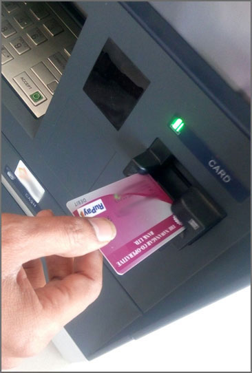Insert a card in the ATM machine